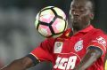 Papa Babacar Diawara of Adelaide controls the ball.