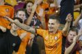 Roar power: Jamie MacLaren celebrates after scoring against Victory at Suncorp Stadium on Saturday night.