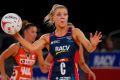 Kate Moloney of Melbourne Vixens goes to throw the ball.