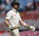 Australia's captain Steven Smith leaves ground after his dismissal for 111 by India's Ravichandran Ashwin during the ...