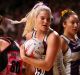 Gretel Tippett of the Firebirds wins the ball during the round six Super Netball match against the Thunderbirds.