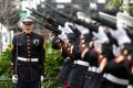 Marines perform a 21 gun salute before the start of the annual Veteran's Day parade in New York, Wednesday, November 11, ...