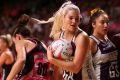 Gretel Tippett of the Firebirds wins the ball during the round six Super Netball match against the Thunderbirds.