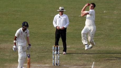 Australia's Pat Cummins, top right, bowls to India's Murali Vijay, foreground.