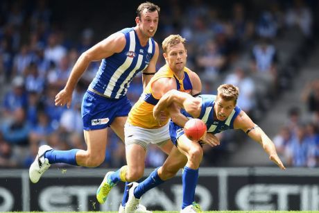 Tight tussle: Former Hawk Sam Mitchell won the midfield battle in his first game for the Eagles.