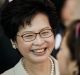 Hong Kong's new chief executive and former chief secretary Carrie Lam outside a polling station for the chief executive ...