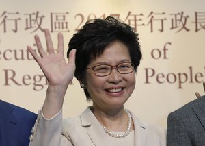 Former Hong Kong Chief Secretary Carrie Lam celebrates after winning the chief executive election of Hong Kong in Hong Kong, Sunday, March 26, 2017. A committee dominated by pro-Beijing elites is casting ballots Sunday to choose Hong Kong's next leader in the first such vote since 2014's huge pro-democracy protests.