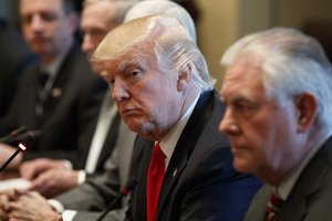 President Donald Trump listens as Iraqi Prime Minister Haider al-Abadi speaks during a meeting in the Cabinet Room of the White House in Washington, Monday, March 20, 2017.