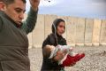The first patients arrived at a new Australian-managed hospital near Mosul on the weekend, a mother with her ...