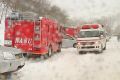 Emergency services vehicles at the scene in Nasu.