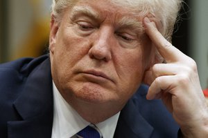 President Donald Trump listens during a meeting with women small business owners in the Roosevelt Room of the White House, Monday, March 27, 2017, in Washington.