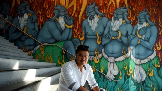 Khadim Ali's mural "The Arrival" depicts the fate awaiting asylum seekers in Australia. 