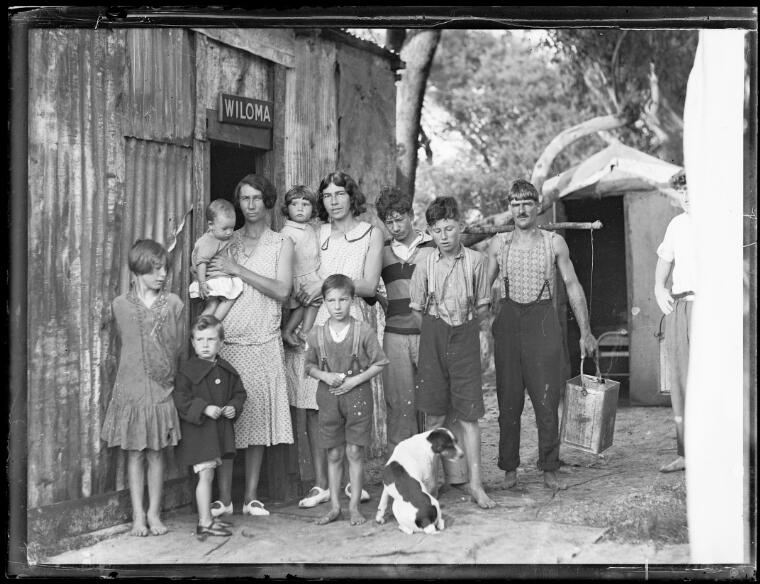 A family standing outside a tin shack called Wiloma during the Great Depression, New South Wales, ca. 1932