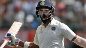 Lokesh Rahul celebrates India's Test and trophy win after posting his sixth half-century of the series.