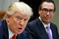 Treasury Secretary Steven Mnuchin listens at right as President Donald Trump speaks during a meeting on the Federal ...