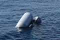 A sunken rubber boat in the Mediterranean Sea off the Libyan coast, during a search and rescue operation by Spanish NGO ...