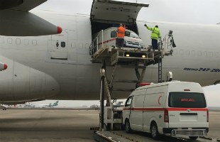 Ambulances being offloaded from airplane in Mosul, Iraq