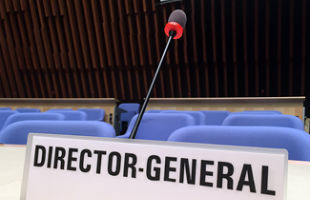 A close-up of the Director-General's seat in the WHO Executive Boardroom.