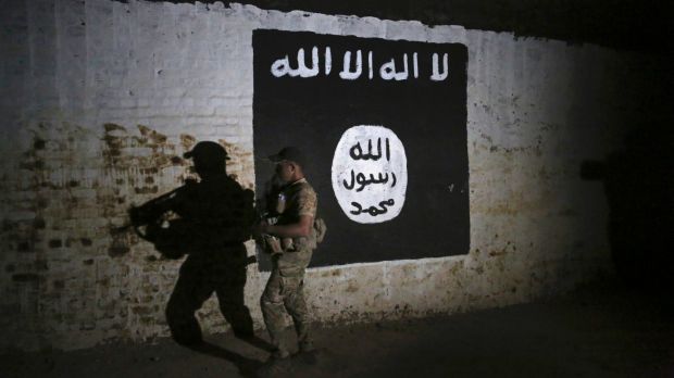 An Iraqi soldier inspects a recently discovered train tunnel on the former Baghdad to Mosul line, which was turned into ...