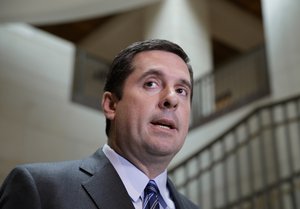 House Intelligence Committee Chairman Devin Nunes, R-Calif., left, speaks to reporters in the Capitol in Washington, Friday, March 24, 2017.