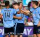 PERTH, AUSTRALIA - MARCH 26: Team mates celebrate with Brandon O'Neill of Sydney FC after scoring during the round 24 ...