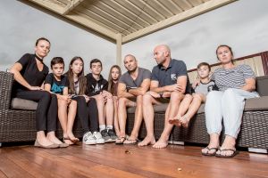 Brothers Craig and Cameron Zammit (pictured with their wives, Michelle and Belinda, and children) are taking up a fight ...