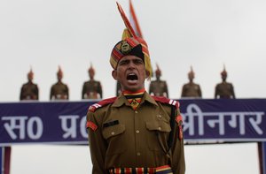 A New recruit of the Indian Border Security Force (BSF) shouts as he takes part during a passing out parade in Humhama, on the outskirts of Srinagar , the summer capital of Indian Kashmir, 08 March 2017. In total 126 recruits were formally inducted into the BSF after completing their training. Now they perform their duty in various parts of India.