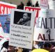 Hundreds of people march through downtown Los Angeles protesting Trump's plan to dismantle the Affordable Care Act.