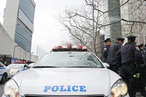 File - Police officers of the New York Police Department (NYPD) stage their vehicles in front of United Nations Headquarters as part of a counter-terrorism drill, 5 April, 2011.