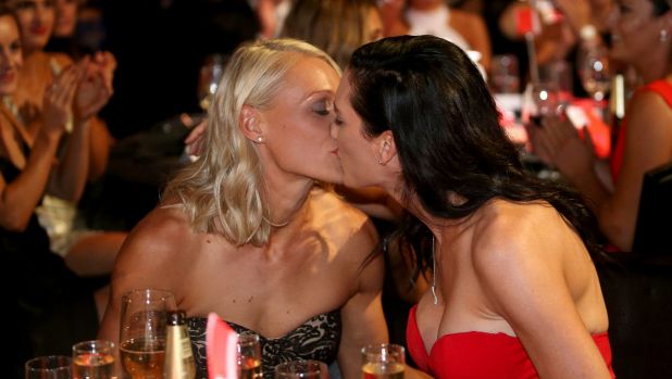 Phillips is congratulated by wife Tracy after winning the AFLW's best and fairest.