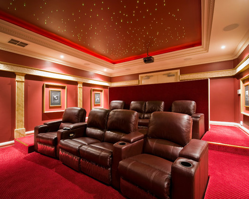 Large traditional enclosed home theatre in Perth with red walls, carpet and a projector screen.