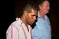 Kevin Henry, then 21, is led away by guards during his 1992 murder trial.