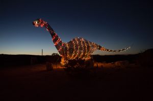 A dinosaur statue stands outside a store off the highway in Terlingua, Texas.