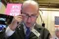 Trader Andrew Silverman works on the floor of the New York Stock Exchange.