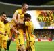 Mathew Leckie of the Socceroos celebrates with teammates after scoring the second goal against the United Arab Emirates ...