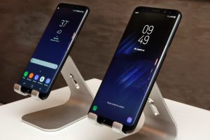 In this Friday, March 24, 2017, photo, new Samsung Galaxy S8, left, and Galaxy S8 Plus mobile phones are displayed in ...