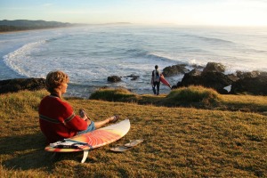 Surfers take to the empty perfect beaches along the Coffs Coast.