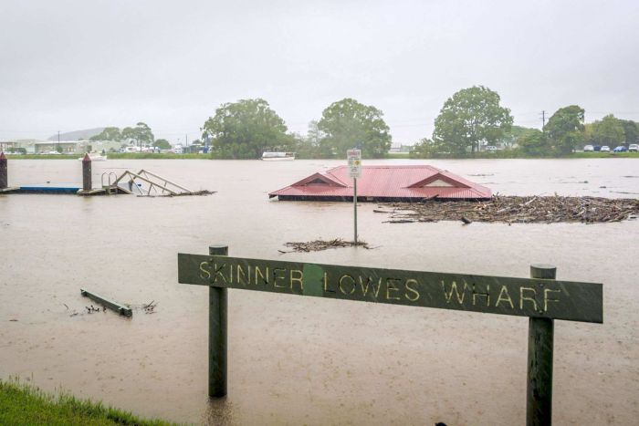 A building nearly completely submerged in water.