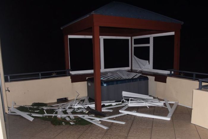 A jacuzzi tub is seen with debris strewn around it in airlie beach