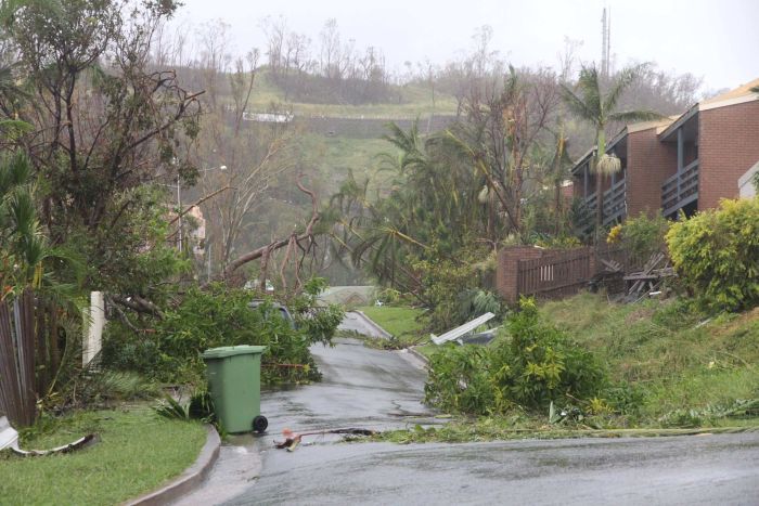 A thunderstorm rolls over Airlie Beach on Wednesday morning, with a major clean-up needed in the town.