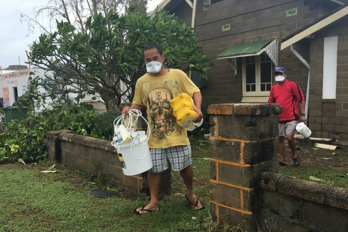 Joe Medil leaves his house with his belongings in Bowen