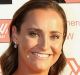 Nicola Stevens (left) with her partner on the coral carpet at the inaugural AFLW W Awards.