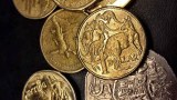 A selection of Australian coins against a black background