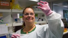 Dr Cara Toscan holds a cell sample