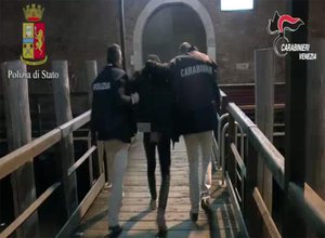 This image taken from a video shows the arrest of one of three Kosovans in the city of Venice, Italy, after one was caught on a phone intercept proposing they bomb the Rialto bridge while others lauded the recent attack in London