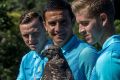 Socceroos (from left) Brad Smith, Tim Cahill, and Rylie McGree at Tarangoa Zoo with Nangaw the owl.
