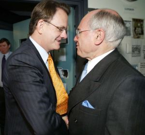 Opposition Leader Mark Latham giving then Prime Minister John Howard a power handshake during the 2004 election ...
