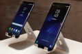 In this Friday, March 24, 2017, photo, new Samsung Galaxy S8, left, and Galaxy S8 Plus mobile phones are displayed in ...