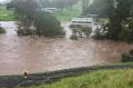 Flooding traps a man and four children in their house at Sarabah in the Gold Coast Hinterland. Queensland Fire and ...