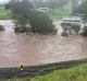 Flooding traps a man and four children in their house at Sarabah in the Gold Coast Hinterland. Queensland Fire and ...